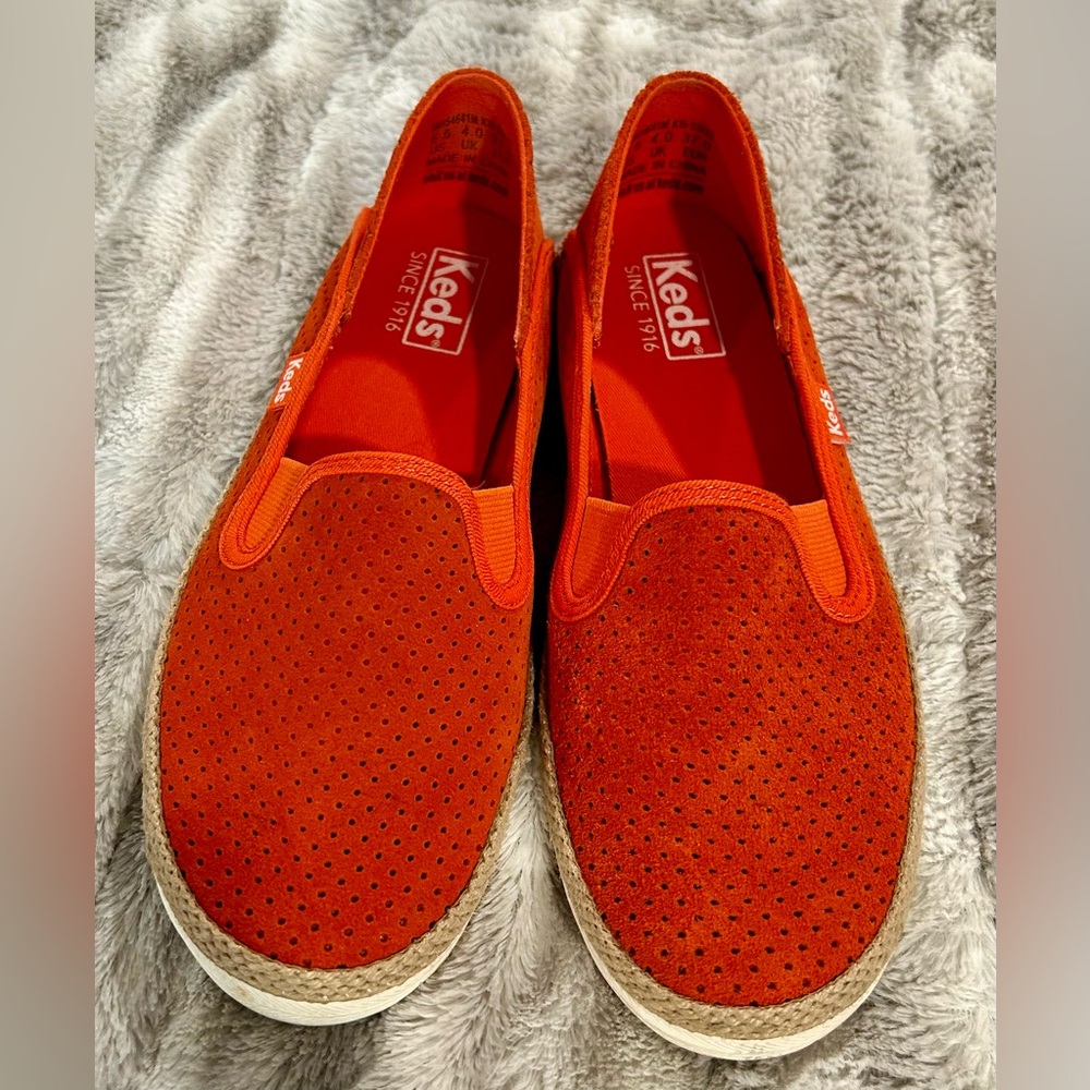 Pair of Keds slip on tangerine leather/suede casual shoes